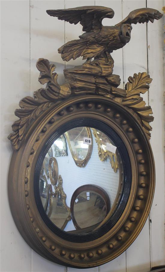 Regency style gilt painted convex mirror